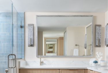 Custom Mirror in the bathroom of a luxury estate home | Aldecor Custom Framing & Gallery - Naples, Florida